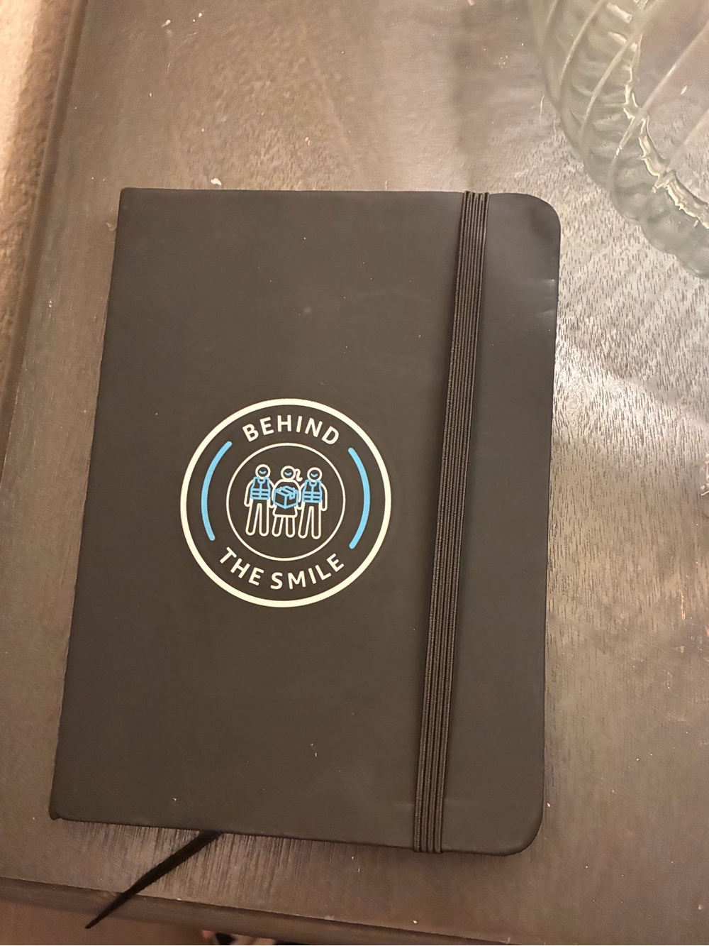 Black 'Behind The Smile' Hardcover Journal with Elastic Closure